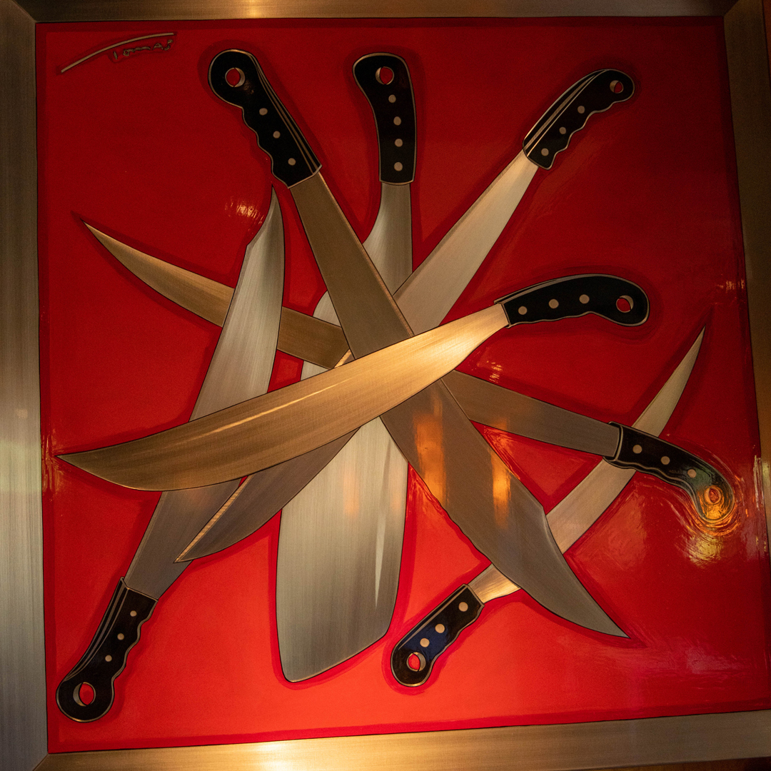 An art piece of multiple chef knives.